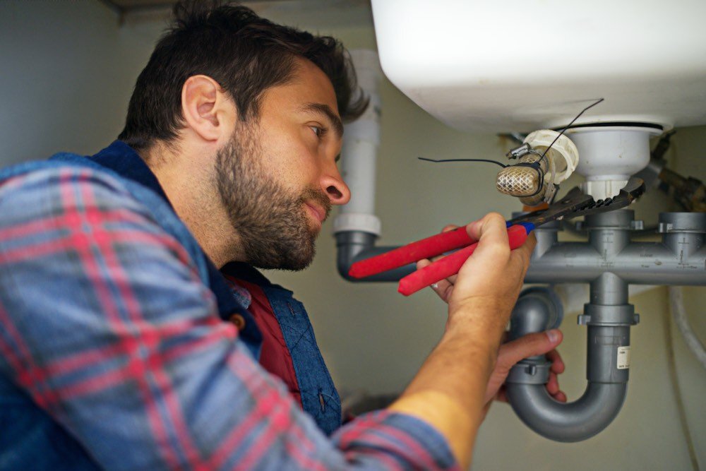 Professional plumber at work